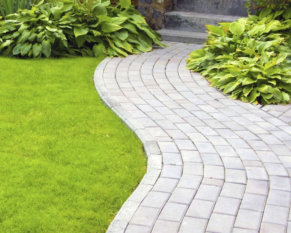 Beautiful curved paver pathway with lush garden landscaping in Adelaide Hills